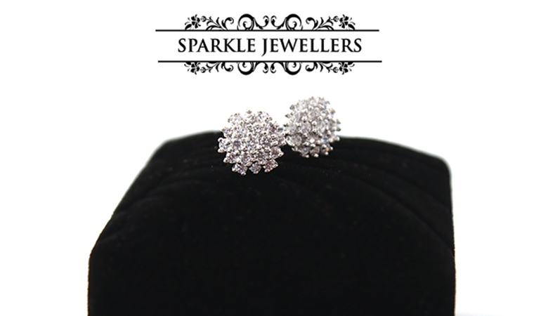 A Pair of 925 Sterling Silver Diamond Cut Studs by Sparkle Jewellers